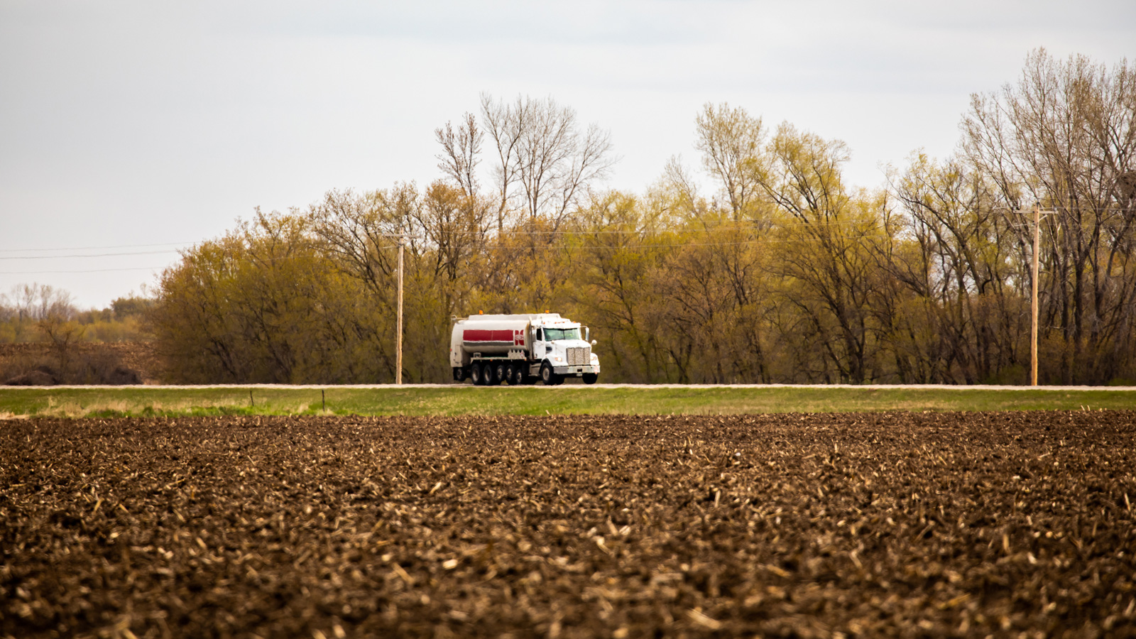 Cenex fuel truck driving down a country road
