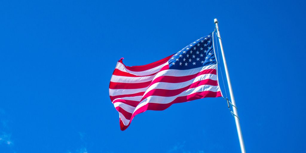 American flag waving in air on a flag pole