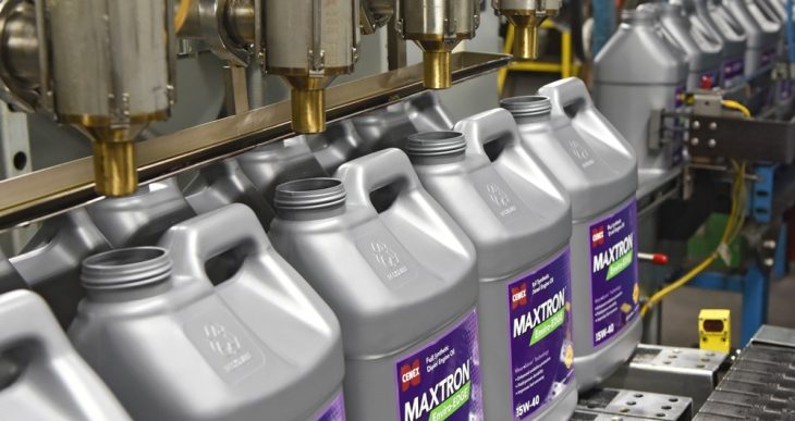 Cenex Maxtron product jugs on a fill line