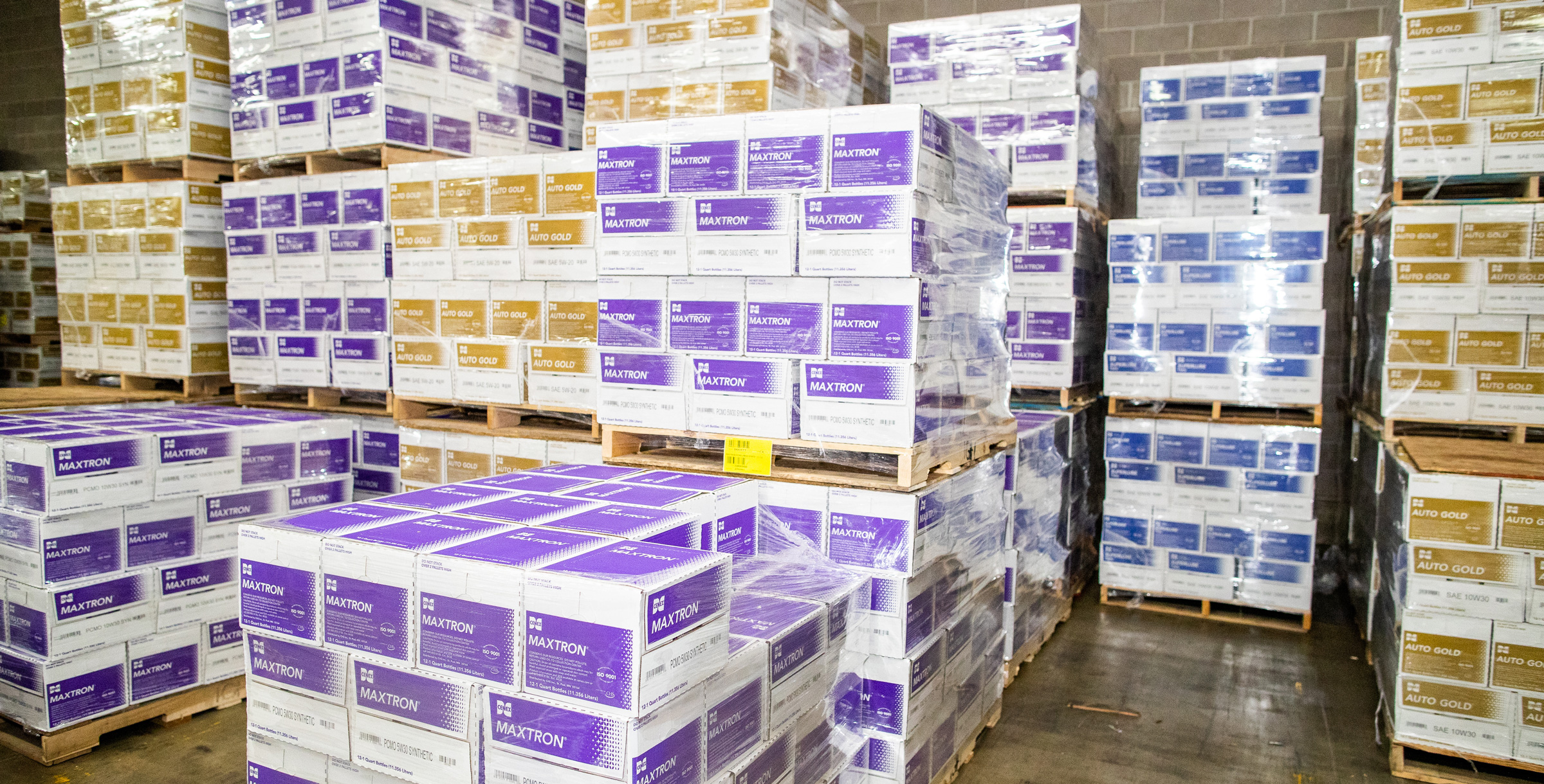 Boxes of Cenex Maxtron and Auto Gold lubricant products on pallets